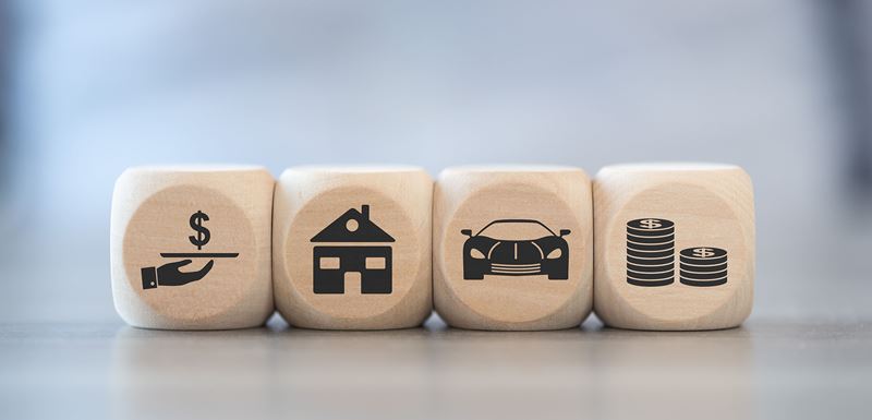 wooden blocks with loan items on them